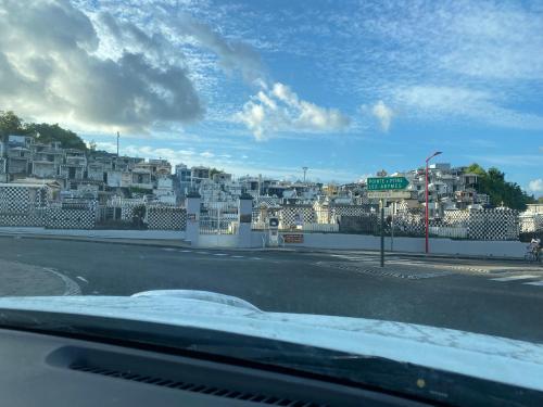 a view of a city from a car at Bas de villa ensoleillé ventilé in Morne-à-lʼEau