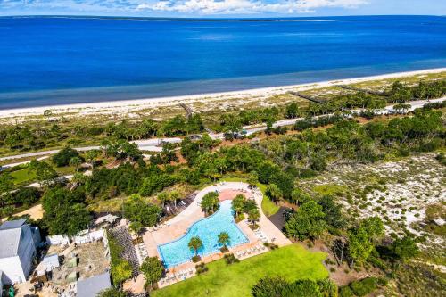 an aerial view of a resort with a pool and the beach at Windmark - The Soaring Gull in Highland View