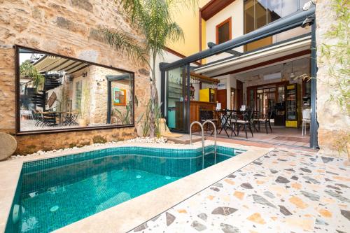 an indoor swimming pool in a home with a house at Saye Konak Hotel ' Kaleiçi&Oldtown' in Antalya