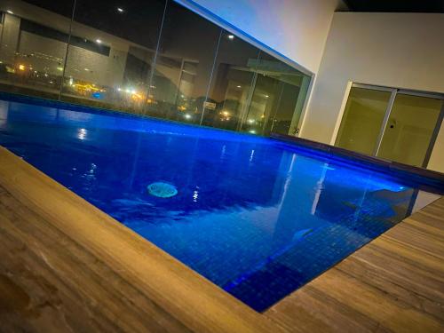 a swimming pool in the middle of a building at hotel vista valle in Tepic