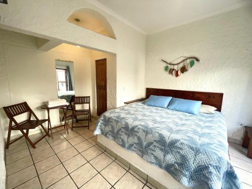 Postel nebo postele na pokoji v ubytování Hotel Allende