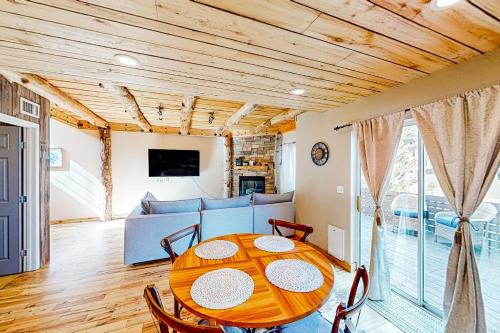 a dining room with a table and a couch at Ponderosa Pine Place in Flagstaff