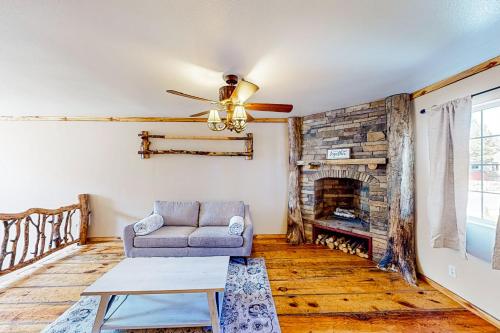 a living room with a couch and a fireplace at Ponderosa Pine Place in Flagstaff