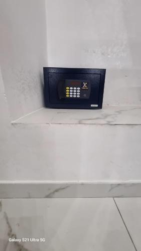 a clock sitting on a counter in a room at San Ciro's Suite in Portici