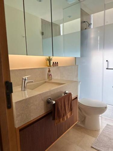 a bathroom with a sink and a toilet at Zantamar New cozy beach front apartment in Cruz de Huanacaxtle