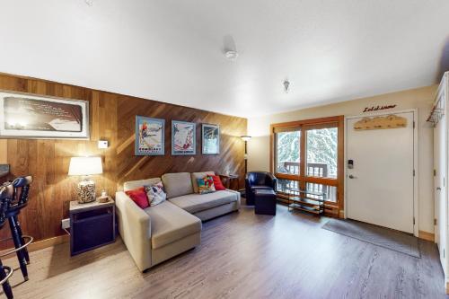 a living room with a couch and a table at North #409 in Anchorage
