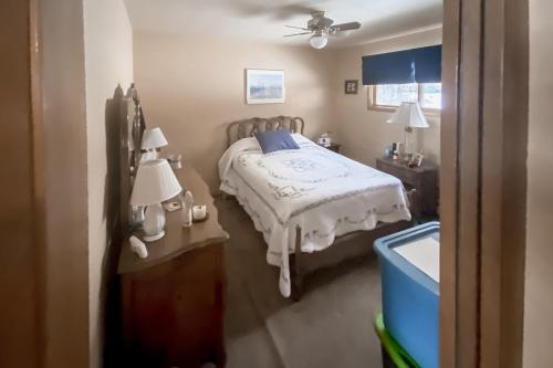 a bedroom with a bed and two night stands and two lamps at Riverfront Paradise - Entire Home in Gypsum