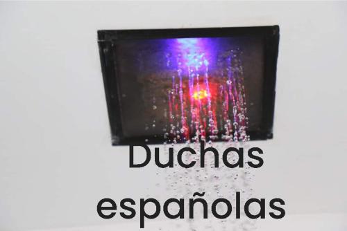 a window with water and the words durgas esparazolis at Stylus Hotel in Iquitos