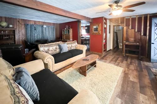 a living room with two couches and a table at Honors Nook in Joseph