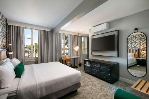 a hotel room with a bed and a television at Hotel Virginia Santa Barbara, Tapestry Collection by Hilton in Santa Barbara