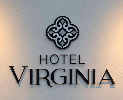 a sign for a hotel virginilla on a wall at Hotel Virginia Santa Barbara, Tapestry Collection by Hilton in Santa Barbara