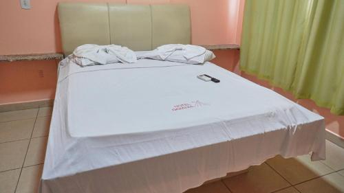 Hotel Goiânia Executiveにあるベッド