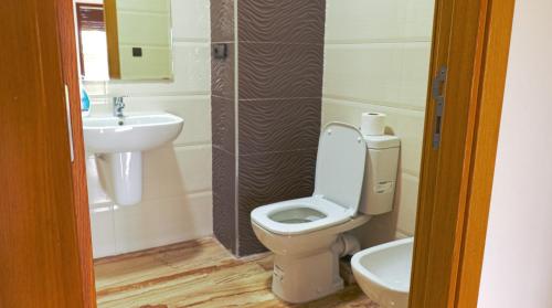 a bathroom with a toilet and a sink at Imran Appart Tanger in Tangier