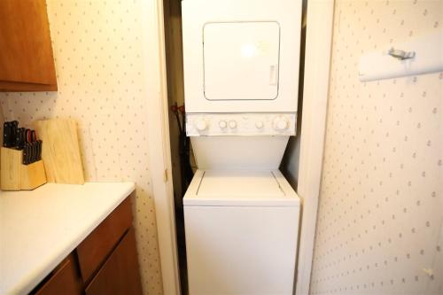 a white washer and dryer in a small kitchen at Beechwood 3, Lincoln, New Hampshire in Lincoln