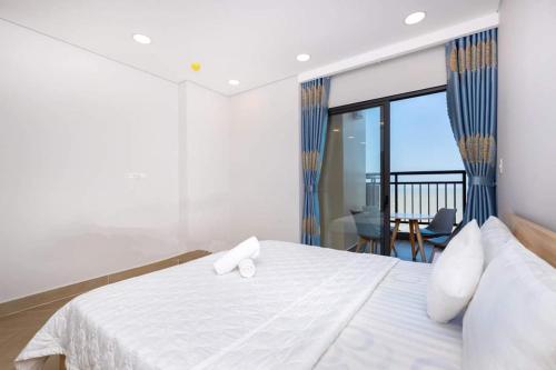 Giường trong phòng chung tại Hảo Aria Resort- Căn hộ, Villa nghỉ dưỡng sát cạnh bãi tắm riêng miễn phí