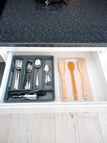 a drawer filled with utensils in a kitchen at P&SApartments in Santa Maria