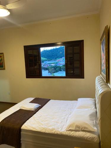 Katil atau katil-katil dalam bilik di HOTEL SOARES CAMARGO