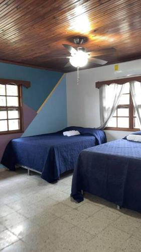 Un ou plusieurs lits dans un hébergement de l'établissement Casa Luna Azul