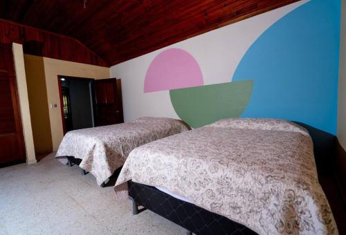 Un ou plusieurs lits dans un hébergement de l'établissement Casa Luna Azul