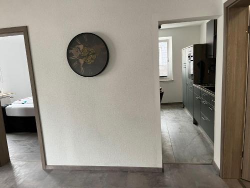 a room with a clock on a wall at International 7 in Bad Harzburg