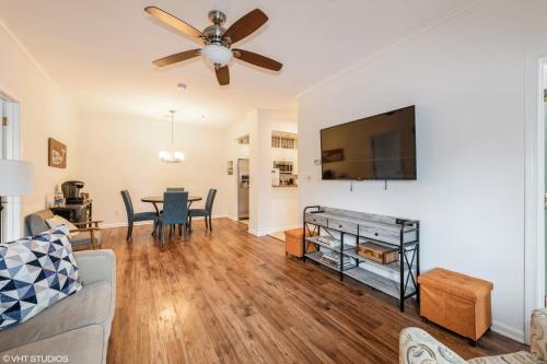 a living room with a couch and a flat screen tv at Comfy, Convenient Close to Rehoboth and Lewes! in Rehoboth Beach