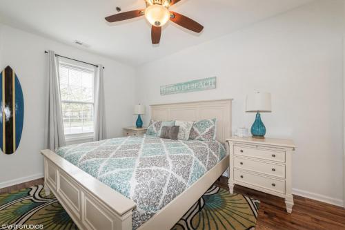 a bedroom with a bed and a ceiling fan at Comfy, Convenient Close to Rehoboth and Lewes! in Rehoboth Beach