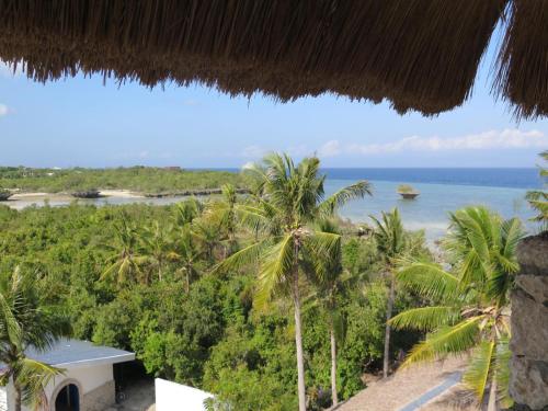 a view of the ocean from a resort at The Wild Orchid Resort - Moalboal in Moalboal