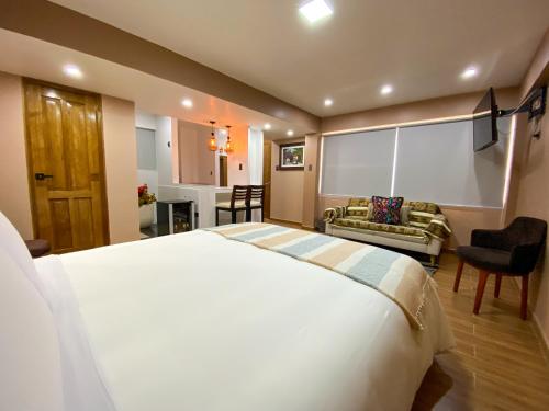 Postel nebo postele na pokoji v ubytování Huallata Hotel Boutique