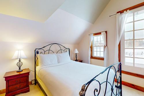 a bedroom with a large bed and a window at The Stock Farm in Chestertown