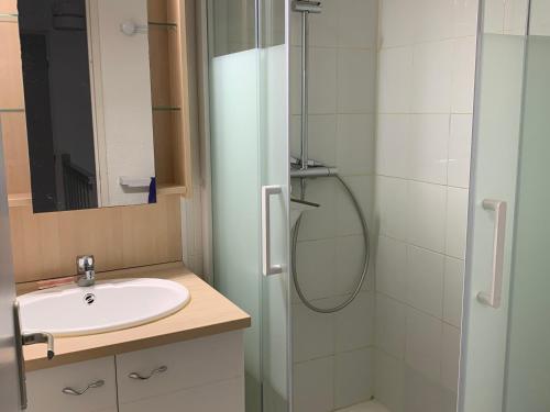 a bathroom with a sink and a shower at Maison à 50m de la Plage avec Parking Privatif - FR-1-482-140 in Fort-Mahon-Plage