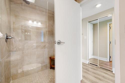 a bathroom with a shower with a glass door at Bayside at Sandestin #6769 in Destin