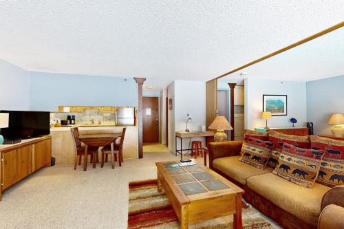a living room with a couch and a table at Lichenhearth # 4 in Snowmass Village