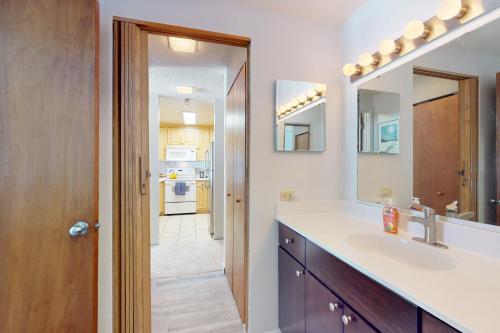 a bathroom with a sink and a mirror at Lichenhearth # 4 in Snowmass Village