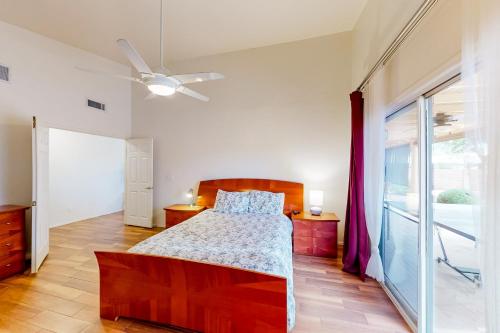 a bedroom with a bed and a ceiling fan at Endless Canyon Escape in Tucson
