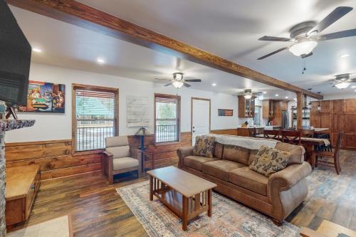 a living room with a couch and a table at Sparrow Cabin in Shaver Lake