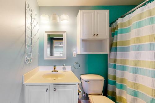 a bathroom with a sink and a toilet and a shower at Bethany Bay --- 30224 Driftwood Court Unit #7504 in Ocean View