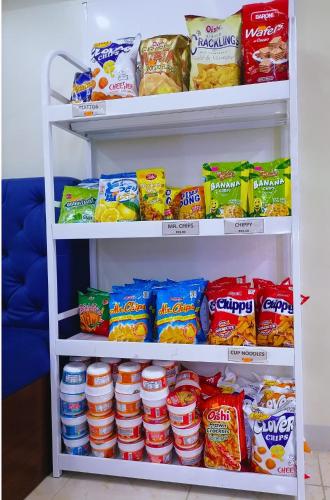 a refrigerator filled with lots of different types of food at Airport Poddotel Inc. in Manila