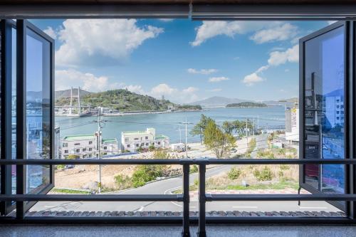 a view of the water from a balcony at Yeosu View Foret Pension in Yeosu