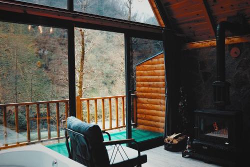 a view of a screened in porch with a fireplace at Golden Rose Bungalov in Ardeşen