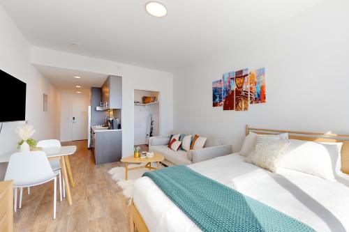 a bedroom with a bed and a living room at Pioche Village #1226 in Park City