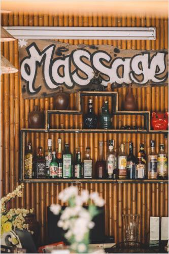 a shelf filled with lots of bottles of alcohol at Trang An Mountain House in Ninh Binh