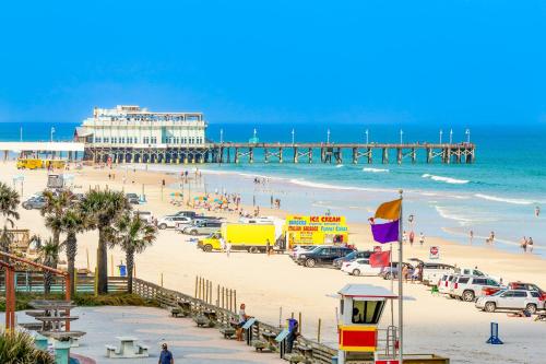 a view of a beach with a pier at Harbour Beach Resort Unit 518 in Daytona Beach