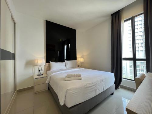 a bedroom with a white bed with a large window at QUINCE HOME GRAND ION DELEMEN GENTING HIGHLANDs in Genting Highlands