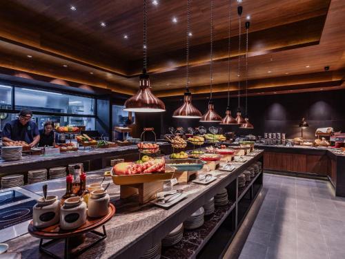 a buffet line with many different types of food at Nysa Hotel Bangkok Sukhumvit 11 in Bangkok