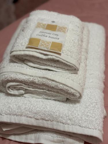a pile of white towels stacked on top of each other at MG Luxury Home in Naples