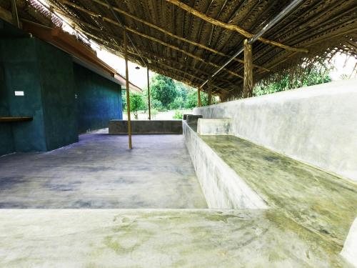 an empty skate park with a ramp in a building at Ritigalafoothills in Habarana