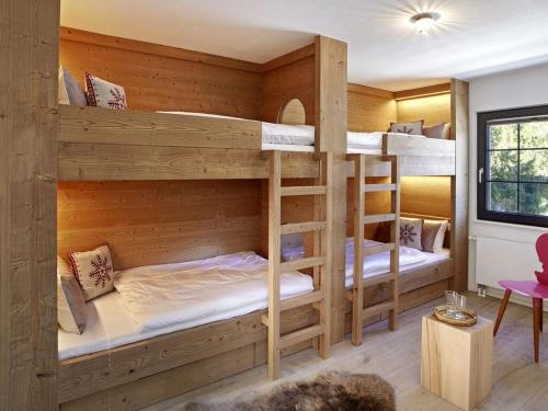 a room with three bunk beds in it at La Maison Titisee Boutique Design in Titisee-Neustadt