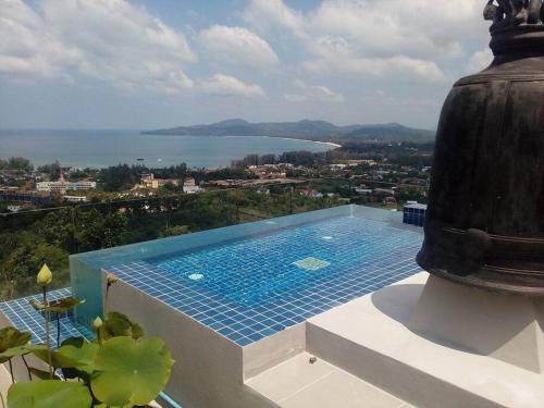 a swimming pool sitting on top of a building at Villa Amonteera in Surin Beach