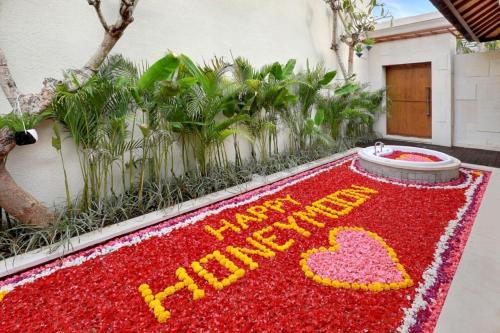 a red floor with the words happy birthday on it at Asvara Villa Ubud by Ini Vie Hospitality in Ubud