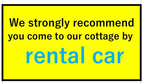 a yellow sign that says we strongly recommend you come to our cottage rental car at 森のフェアリー Cottage Morino Fairy All cotage with open-air bath with sea view or river view in Yakushima
